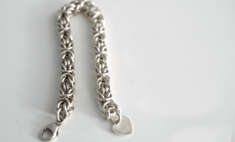 silver bracelet that is partially tarnished