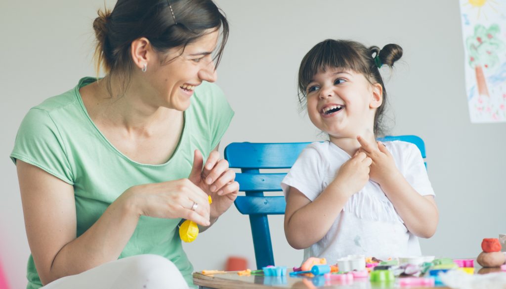 mom and daughter having fun together making art